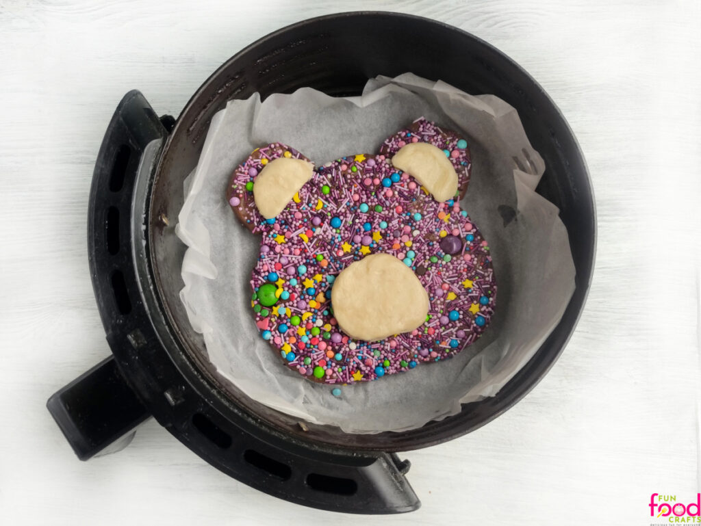 Large teddy bear cookie dough in an air fryer