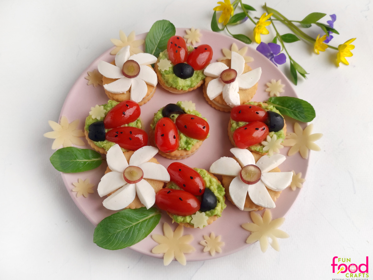 overhead shot of finished ladybug and cheese flower appetizers