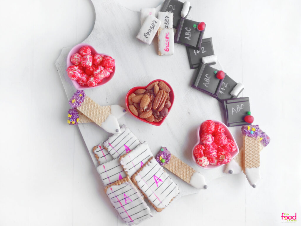 Filling the back to school charcuterie board with treats