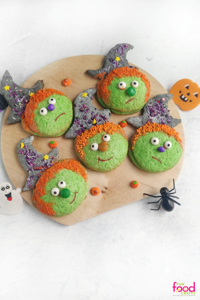 Finished Halloween Pi&ntilde;ata Cookies on a brown board
