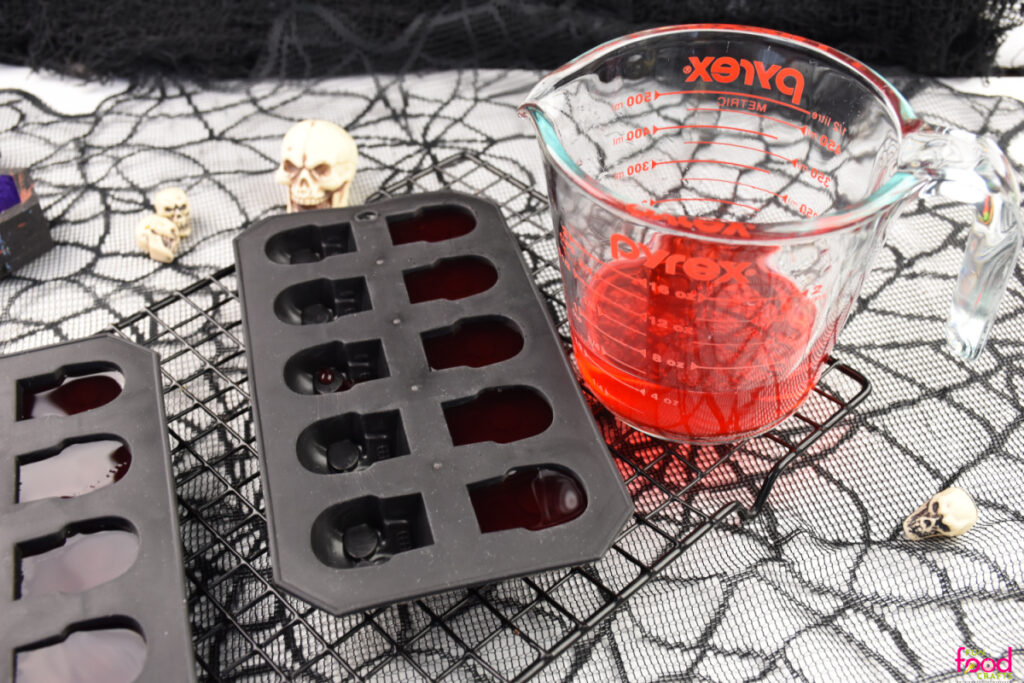 Pouring the mixture into skull-shaped