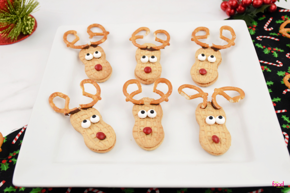 close up of Nutter Butter Reindeer cookies on a white plate